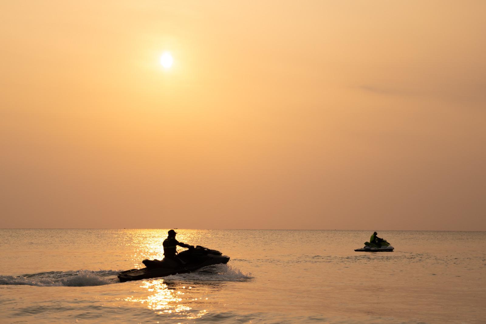 A Man riding a Jetski in the ocean
