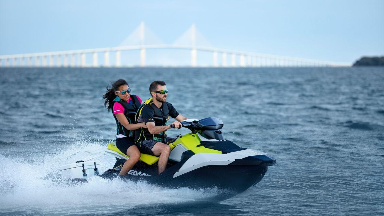 Debug Auto Exclusive vehicle inquiries - A couple riding a Sea-doo spark