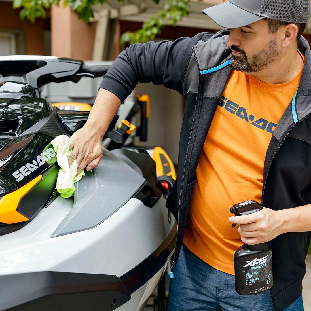Debug Auto Exclusive after-care inquires selector image - A person cleaning a Sea-Doo jetski